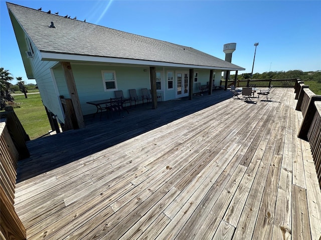 deck featuring french doors and outdoor dining area