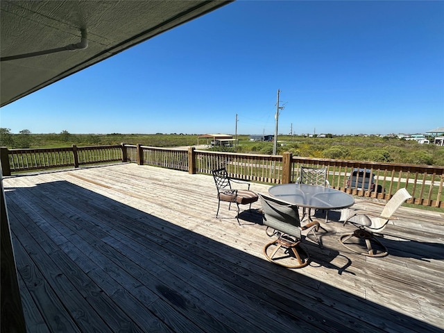 deck featuring outdoor dining area