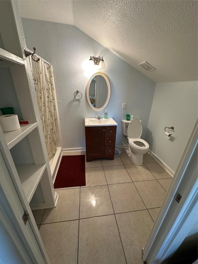 bathroom with visible vents, a textured wall, toilet, tile patterned floors, and a textured ceiling