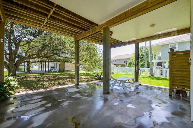 view of patio / terrace featuring fence