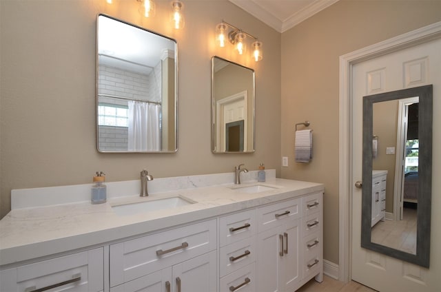 bathroom featuring ornamental molding, a sink, a shower with shower curtain, and double vanity