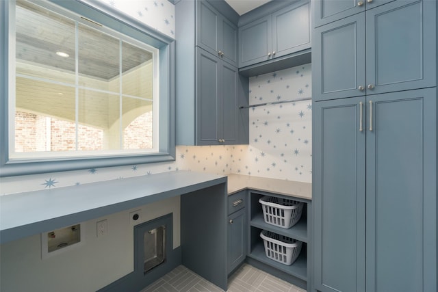 kitchen with light tile patterned floors and light countertops