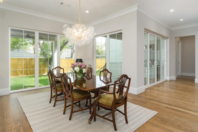 dining space with recessed lighting, light wood-type flooring, visible vents, and crown molding