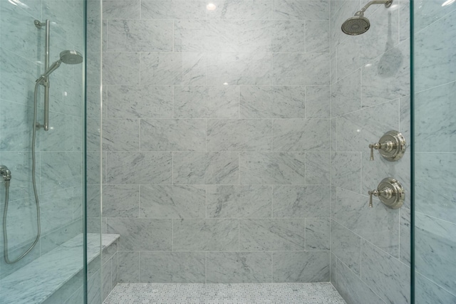 bathroom featuring a tile shower