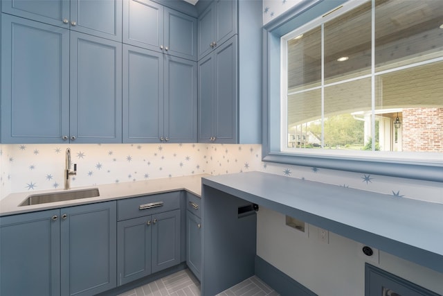 laundry area with a sink