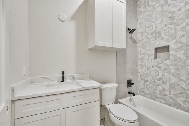 bathroom with tub / shower combination, vanity, and toilet