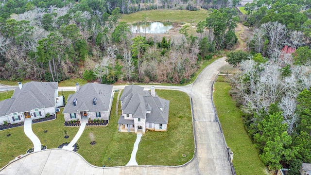 bird's eye view with a water view and a residential view