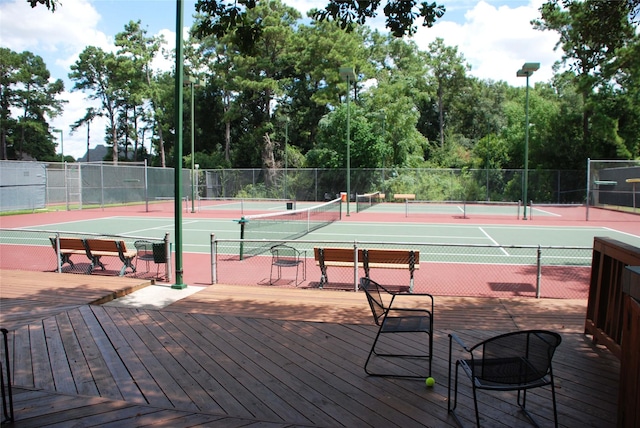 view of sport court with fence