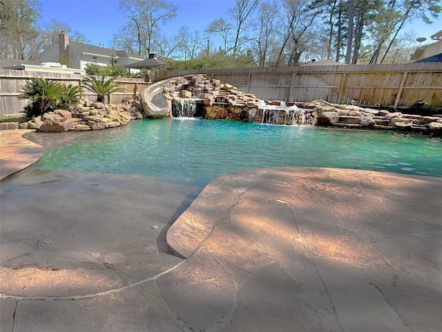 view of swimming pool featuring a fenced in pool, a patio area, and a fenced backyard