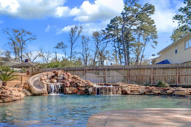 view of pool featuring a fenced backyard