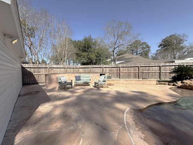 view of yard featuring a patio area and a fenced backyard