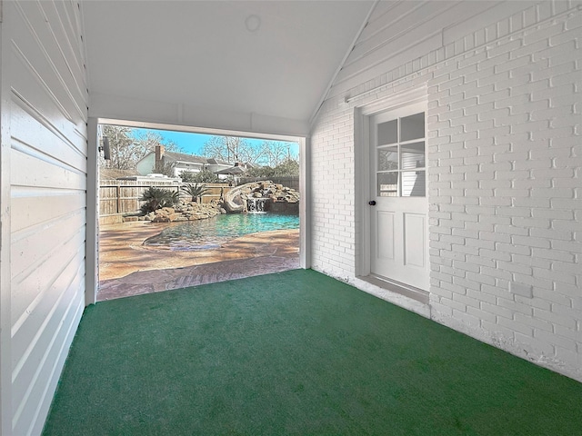 unfurnished sunroom with lofted ceiling