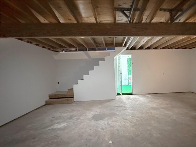 basement featuring stairs