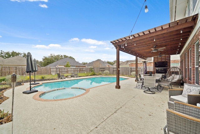 view of pool with a patio, a fenced backyard, a pool with connected hot tub, a ceiling fan, and outdoor dining space