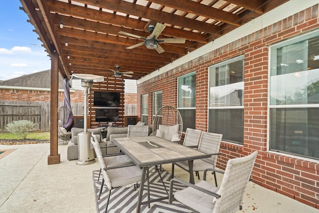 view of patio / terrace with ceiling fan, fence, outdoor lounge area, and outdoor dining space