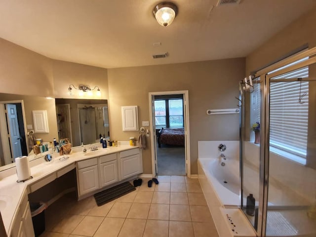 full bathroom with tile patterned flooring, visible vents, vanity, a bath, and a stall shower