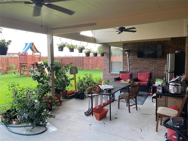 view of patio / terrace featuring a playground and a fenced backyard