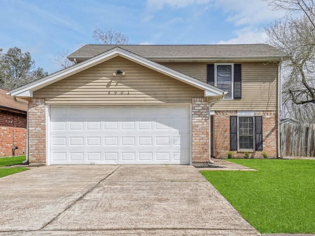 traditional-style home with a garage, fence, driveway, roof with shingles, and a front lawn