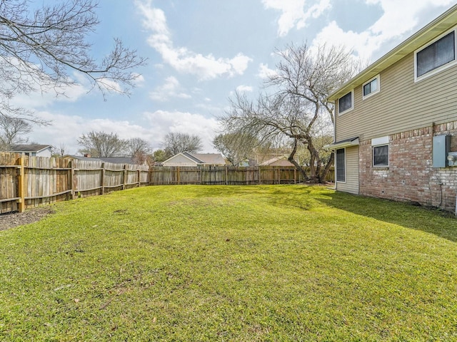 view of yard featuring a fenced backyard