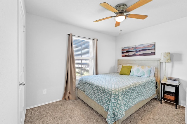 bedroom featuring ceiling fan, carpet, and baseboards