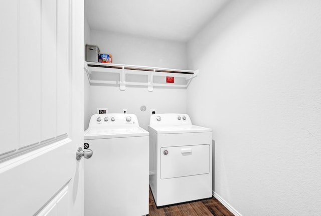 clothes washing area featuring laundry area, dark wood-type flooring, and independent washer and dryer