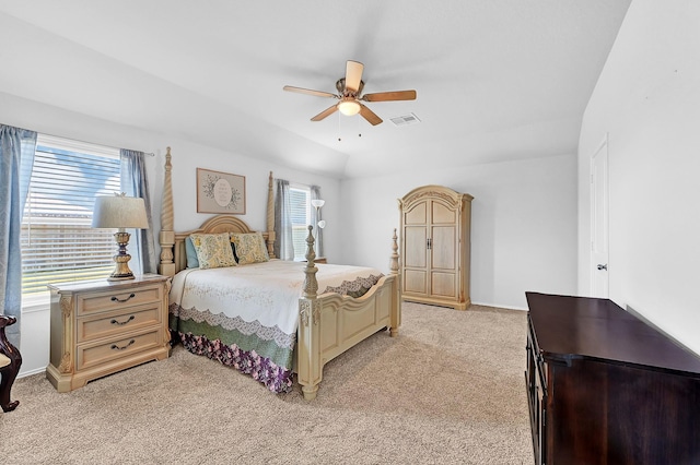 bedroom featuring light carpet, baseboards, visible vents, a ceiling fan, and vaulted ceiling