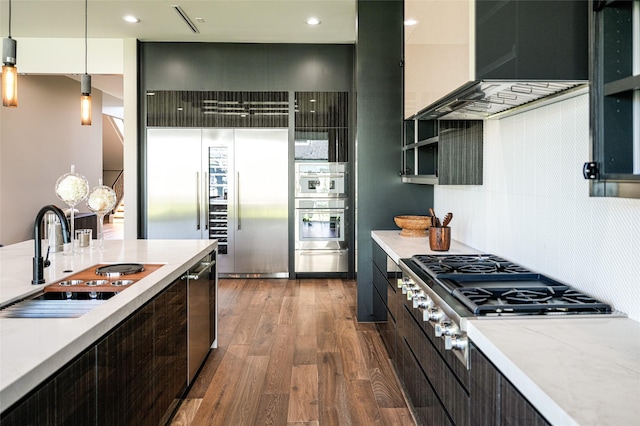 kitchen featuring a sink, modern cabinets, appliances with stainless steel finishes, and light countertops