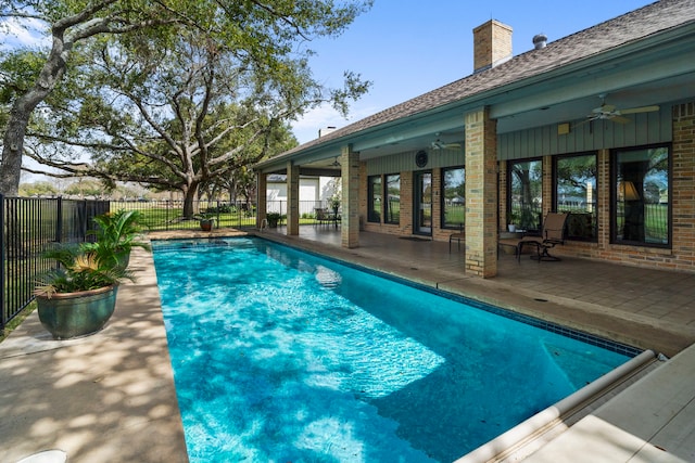 view of pool featuring a ceiling fan, a fenced in pool, a fenced backyard, and a patio