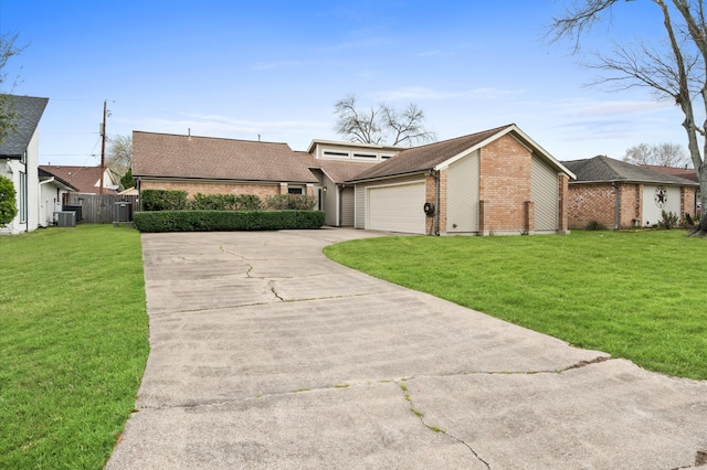 mid-century inspired home with brick siding, concrete driveway, an attached garage, central AC unit, and a front yard