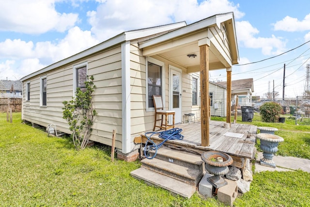 view of outbuilding with fence