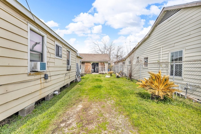 view of yard with cooling unit and fence