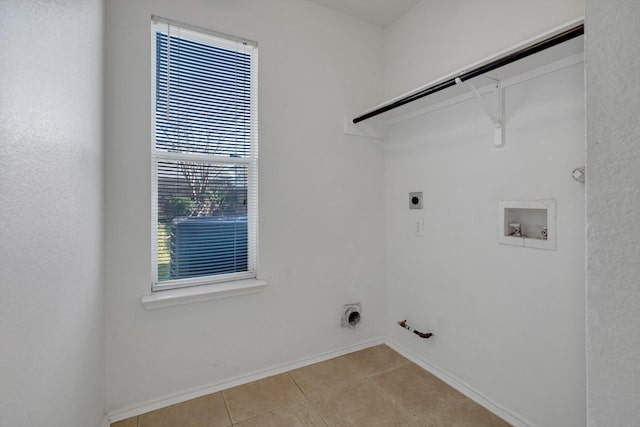 laundry room featuring laundry area, gas dryer hookup, hookup for a washing machine, hookup for an electric dryer, and light tile patterned flooring