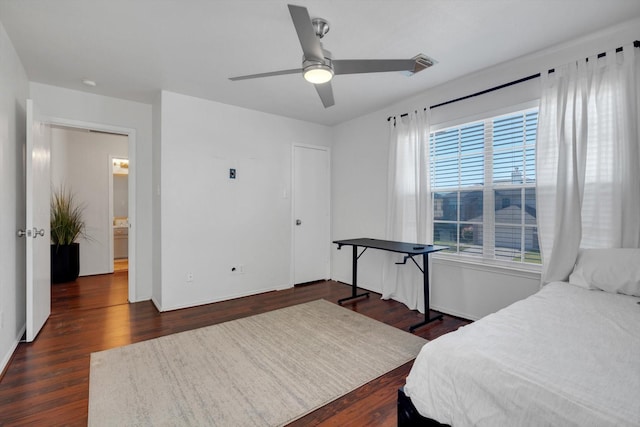 bedroom with ceiling fan and dark wood-style flooring