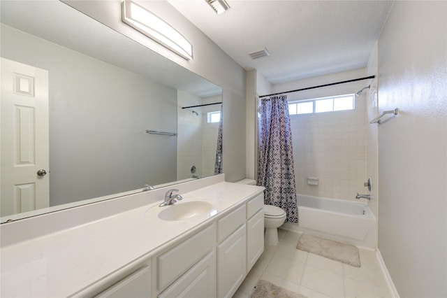 full bathroom featuring visible vents, toilet, vanity, baseboards, and tile patterned floors