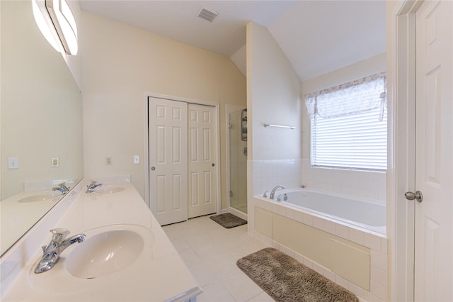 bathroom featuring a bath, visible vents, and a sink