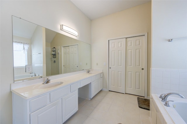 bathroom with tile patterned flooring, a sink, a bath, double vanity, and a stall shower