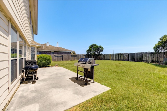 view of yard featuring a patio area and a fenced backyard