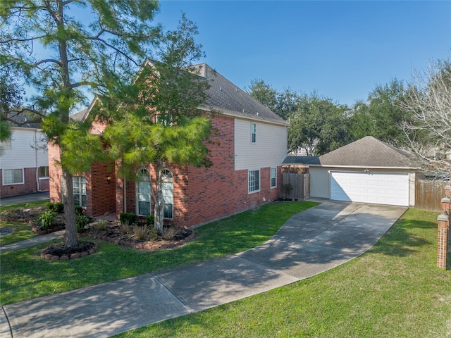 view of front facade with a garage, a front yard, fence, and brick siding