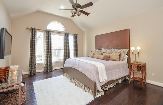 bedroom featuring vaulted ceiling, wood finished floors, baseboards, and ceiling fan