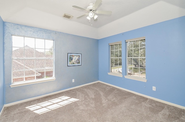 unfurnished room with visible vents, baseboards, and carpet floors