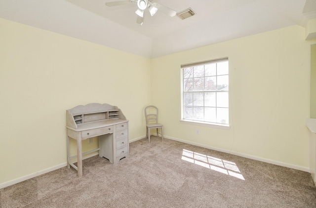 interior space featuring a ceiling fan, visible vents, and baseboards