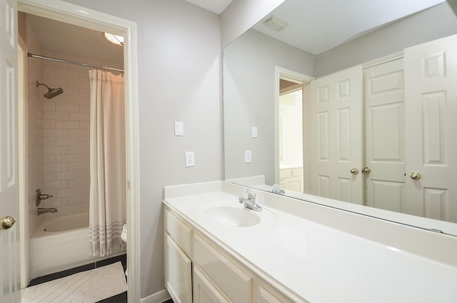 bathroom with visible vents, shower / tub combo, toilet, and vanity