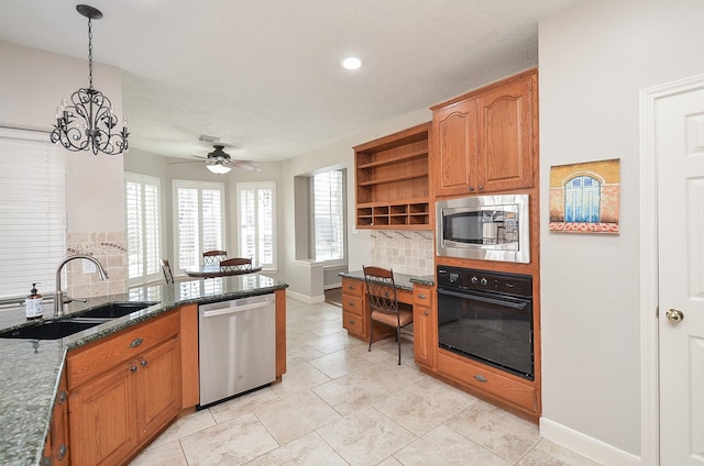 kitchen featuring open shelves, a sink, stainless steel appliances, ceiling fan with notable chandelier, and tasteful backsplash