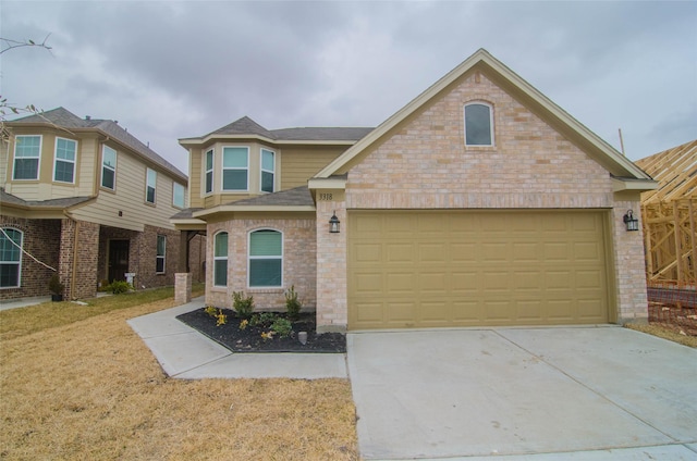 view of front of property with driveway, brick siding, a front lawn, and an attached garage