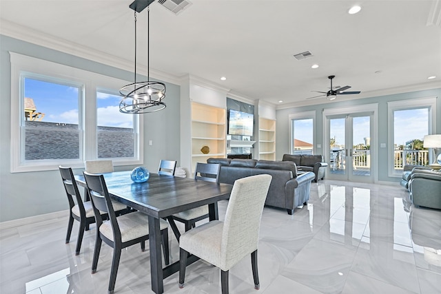 dining area with visible vents, crown molding, and french doors