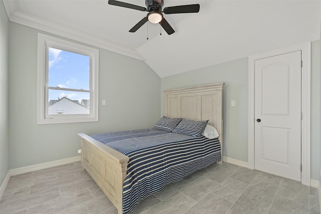 bedroom with a ceiling fan, lofted ceiling, and baseboards