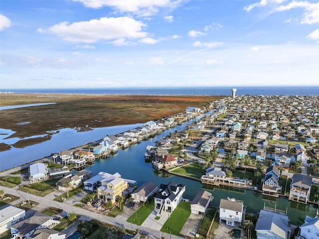 birds eye view of property with a residential view and a water view