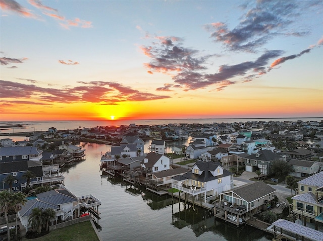 bird's eye view with a water view and a residential view