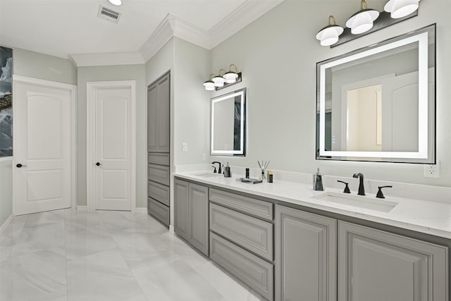 bathroom featuring double vanity, visible vents, a sink, and ornamental molding