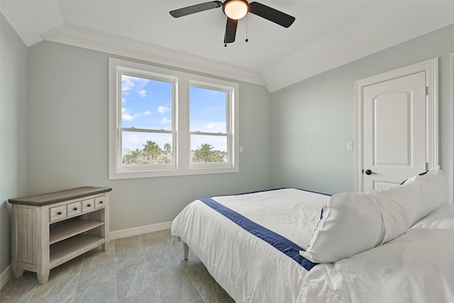 bedroom featuring lofted ceiling, ceiling fan, baseboards, and crown molding